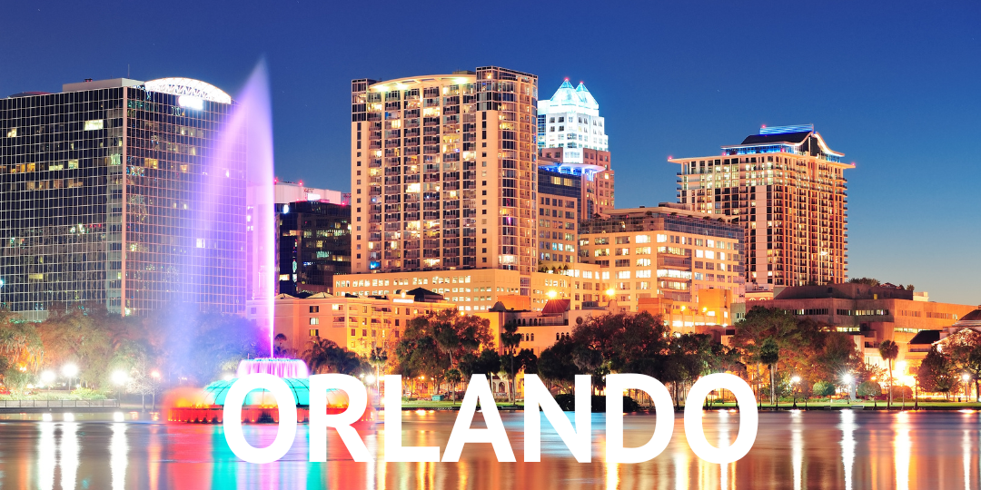 A photo of Orlando, Florida at night, with white letters writing ORLANDO.